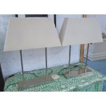 ANDREW MARTIN TABLE LAMPS, a pair, with cream shades, 65cm H.