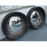 BUTLER MIRRORS, a pair, circular in black frames with gilding 45cm diam.