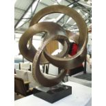 SCROLLING ENTWINED SCULPTURE, bronze coloured resin, on marble plinth, 93cm H overall.