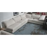 CORNER SOFA, by Flexiform, in cream, on metal supports, 336cm x 261cm.