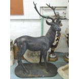 CAST IRON STAGS, a pair, in an elegant pose, 165cm H x 110cm L.