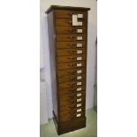BANK OF DRAWERS, early 20th century fruitwood with seventeen drawers,