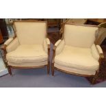 BERGERES, a pair, Louis XVI style beechwood in sand coloured fabric with cushion seats, 76cm.