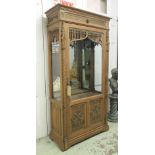 DISPLAY CABINET, early 20th century French Gothic oak tracery with glazed door and mirror back,