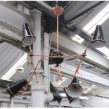 'TORPHANE' SUSPENSION LAMP, copper plated brass arms with adjustable black aluminium shades,