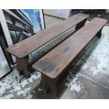 BENCHES, a pair, vintage pine with stretchered trestle supports, 213cm x 28cm W.
