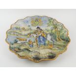 MAJOLICA WALL PLATE, 19th century Continental, with scalloped border,