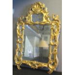 WALL MIRROR, Louis XV mid 18th century giltwood with shell,