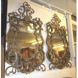 WALL MIRRORS, a pair, of Rococo style gilt effect with S scroll and leaf decoration,