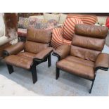 ARMCHAIRS, a companion pair, 1970's tan leather and black framed, one with three cushion back,