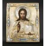 RUSSIAN ICON, depicting Christ, the hallmarked silver oklad decorated with coloured enamels,