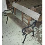 GARDEN BENCH, Victorian design with naturalistic cast iron ends, wooden plank seat,