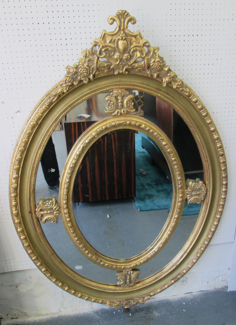 MIRROR, Louis XV style, oval, bevelled plate, with ornate gilded frame, 140cm x 99cm.