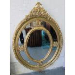 MIRROR, Louis XV style, oval, bevelled plate, with ornate gilded frame, 140cm x 99cm.