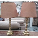 TABLE LAMPS, a pair, Gothic style brass, 73cm H x 40cm W, including shades.