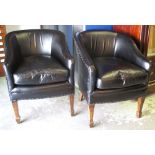 TUB CHAIRS, a pair, 20th century in black leather with cushion seats, 65cm W.