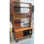 G-PLAN CABINET, 1970's teak, ebonised, cream painted and bronze suspended with marble shelves,
