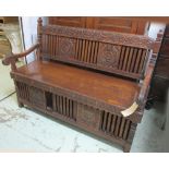 HALL BENCH, Philippine narrowood with highly carved back and arms, 141cm W.