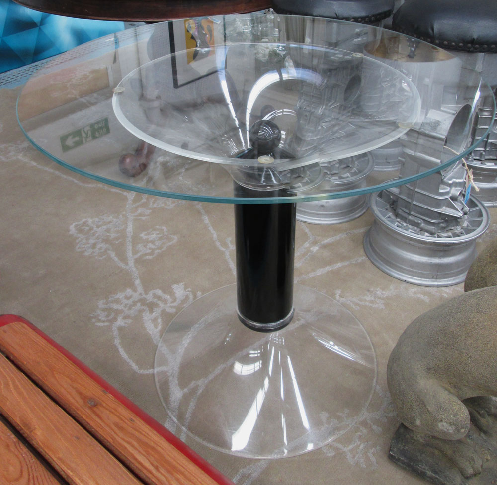 DINING TABLE, 1970's the circular glass top on a perspex base with black column, 90cm x 77cm H.