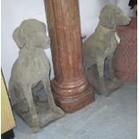 GARDEN DOG STATUES, a pair, 19th century Cotswold stone style in a weathered finish,