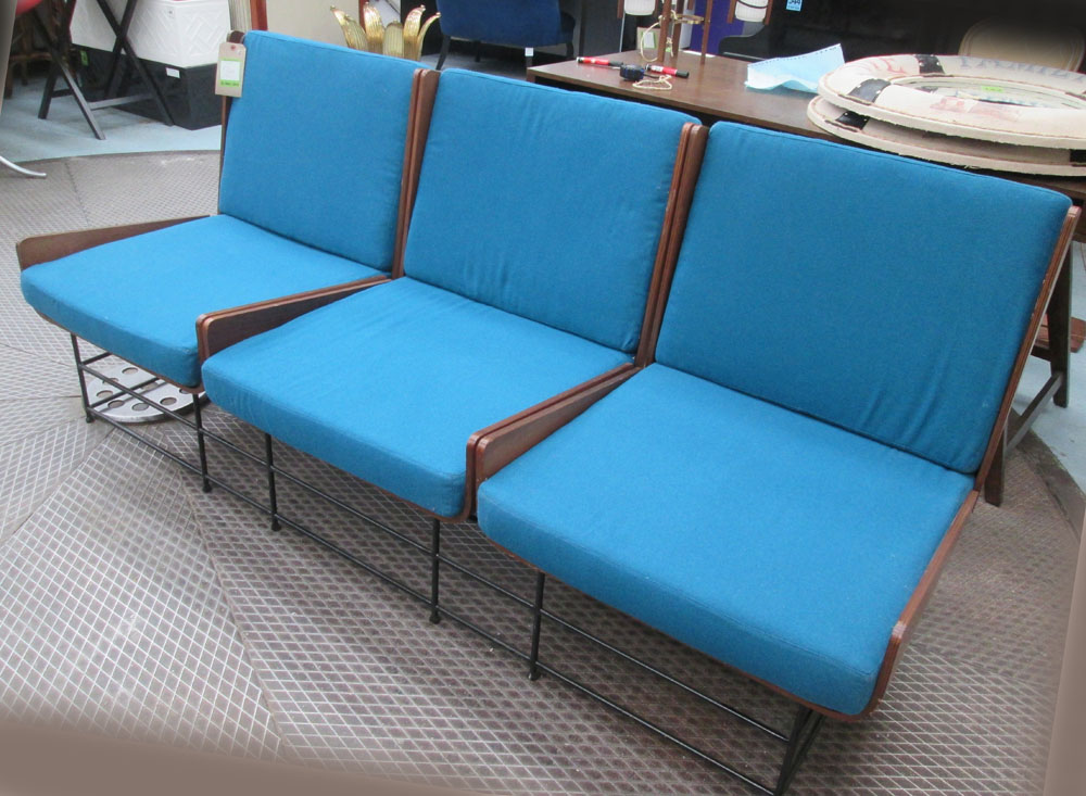 SOFA, Italian, with three individual seats, bentwood with blue upholstery on black metal supports,