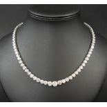 18k WHITE GOLD & DIAMOND NECKLACE, set with 80 graduated diamonds between 2.3 ct to .5ct.