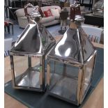 STORM CANDLE LANTERNS, a pair, 'Culinary Concepts' design, plated metal, glass lined,