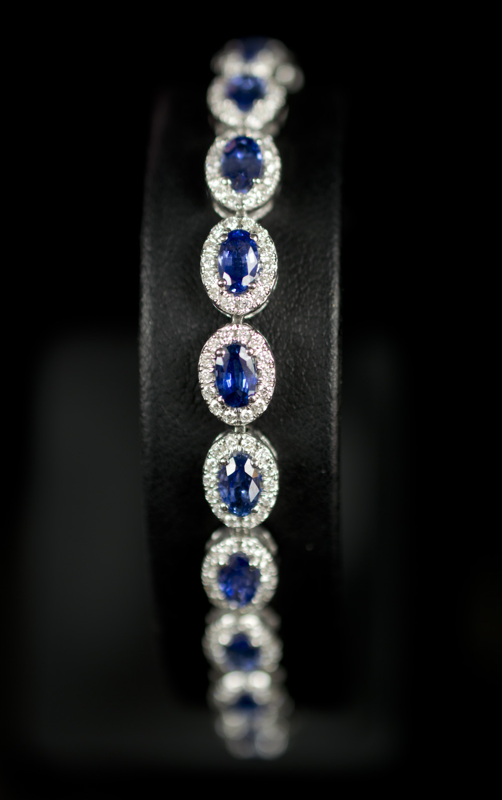 DIAMOND AND SAPPHIRE ARTICULATED CLUSTER BRACELET,