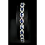 DIAMOND AND SAPPHIRE ARTICULATED CLUSTER BRACELET,