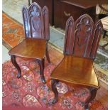 HALL CHAIRS, a pair, Victorian mahogany, in the Gothic manner,