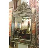 WALL MIRROR, Dutch repoussé style silvered metal, rectangular with marginal plates and crest,