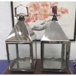 STORM CANDLE LANTERNS, a pair, 'Culinary Concepts' design, plated metal, glass lined,