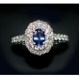 SAPPHIRE AND DIAMOND CLUSTER RING, 18k white gold.