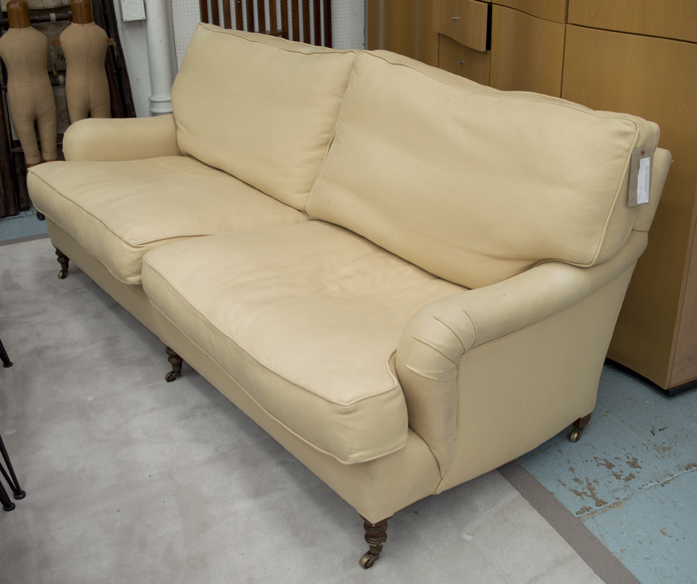 GEORGE SMITH SOFA, in woven sand coloured fabric with three turned front supports,