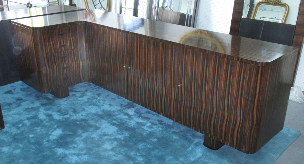 CORNER SIDEBOARD, Art Deco style, Macassar wood, with three cupboards and five drawers,