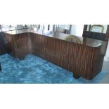 CORNER SIDEBOARD, Art Deco style, Macassar wood, with three cupboards and five drawers,