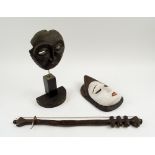 TRIBAL ARTS, comprising a Pune mask, a mask on stand and a stringed instrument, 54cm L.