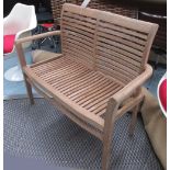 GARDEN BENCH, two seater, in slatted teak on square supports, 122cm L.