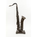 SAXOPHONE SCULPTURE, bronze with integral stand, 70cm H overall.