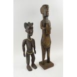 TRIBAL FIGURES, West African, carved wood studies of a male warrior,
