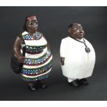 CARICATURE FIGURE CARVINGS, West African, of a husband and wife, painted wood, 28cm H x 33cm W.