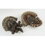 DAN FACE MASKS, two similar, carved wood with bound cloth and cowrie shell decorated surrounds,