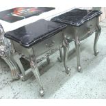 BEDSIDE TABLES, a pair, the shaped viewed black marble tops on silver gilt bases with drawers,