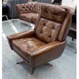 REVOLVING EASY ARMCHAIR, brown leather upholstered, revolving on a five point chrome support.
