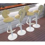 BAR STOOLS, a set of four, Christopher Guy style, upholstered in a raw sienna soft leather,