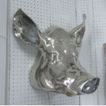 WALL ORNAMENT, a pig's head in chromed metal, 45cm H.