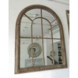 GARDEN MIRRORS, a pair, with an arched top in a rustic style finish, 88cm x 69cm.