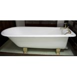 BATH, white enamelled cast iron with brass feet, taps and fittings (edge, 61cm H x 190cm L x 81cm W.