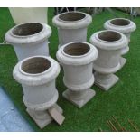 GARDEN URNS/PLANTERS, a set of four, in reconstituted stone plus a larger pair, 37cm x 43cm H.