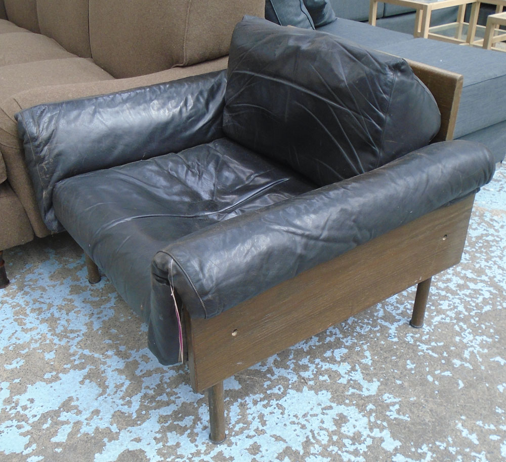 RETRO ARMCHAIR, 1970's, with black leather upholstery, wooden panelled back and sides,